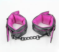 Black Padded Wrist Cuffs With Hot Pink Lining